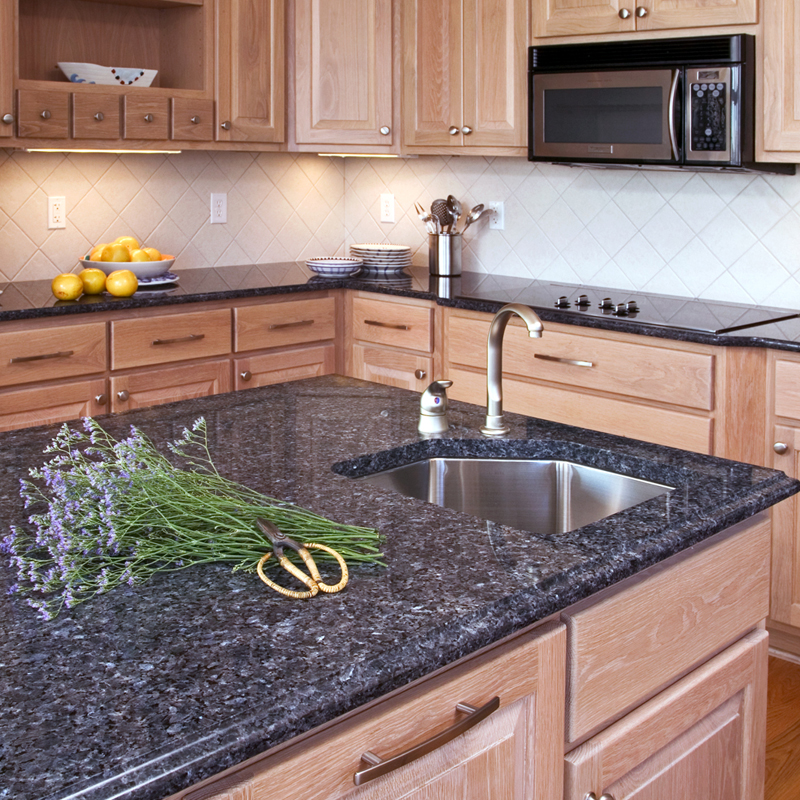 Blue pearl granite countertop with grey cabinets